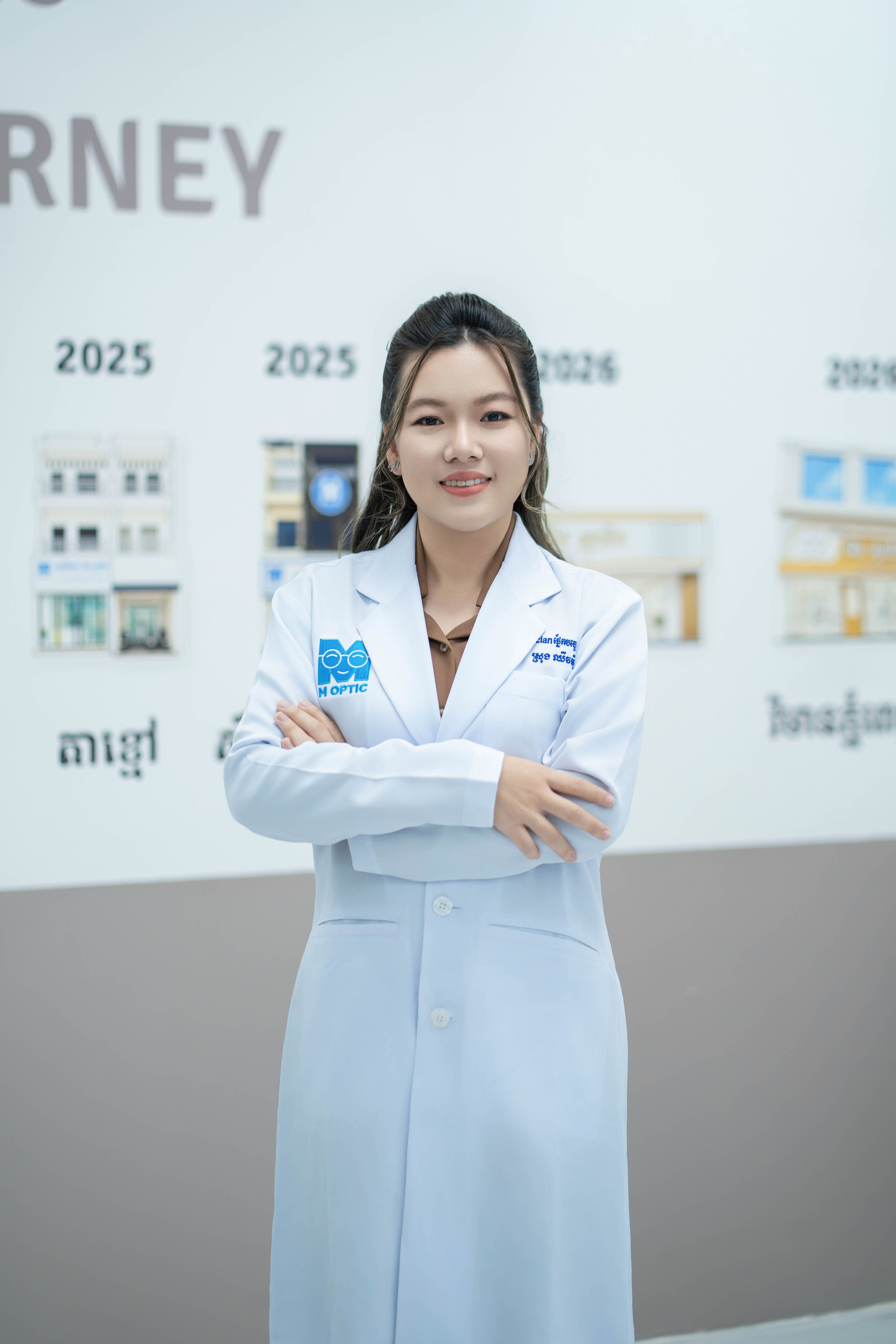 Srong Chhivmey, founder and CEO of M-Optic eyewear brand in Cambodia, in professional optician coat